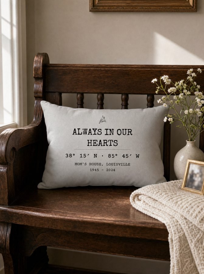 Always In Our Hearts pillow on a dark wood bench